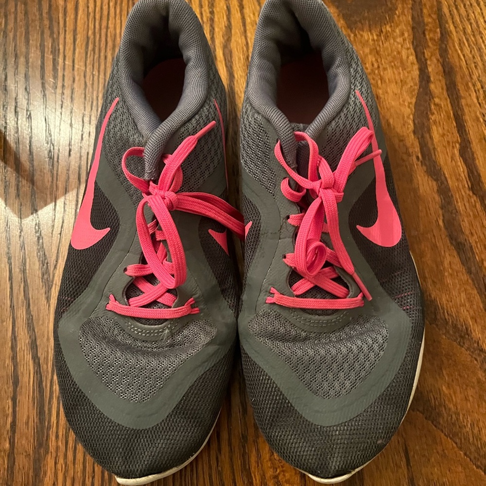 Women’s size 9 Nike flex lovingly worn grey and pink tennis shoes